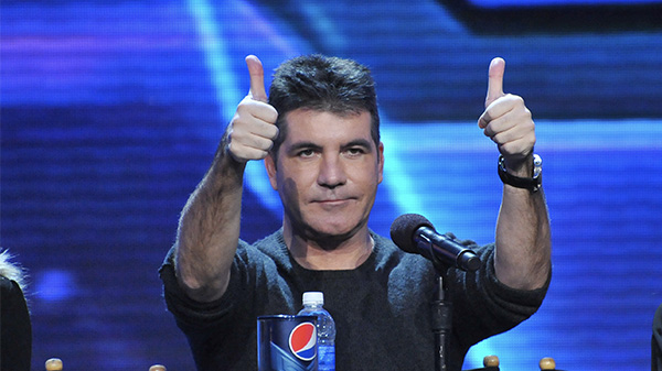 Simon Cowell contemplating his tough decision