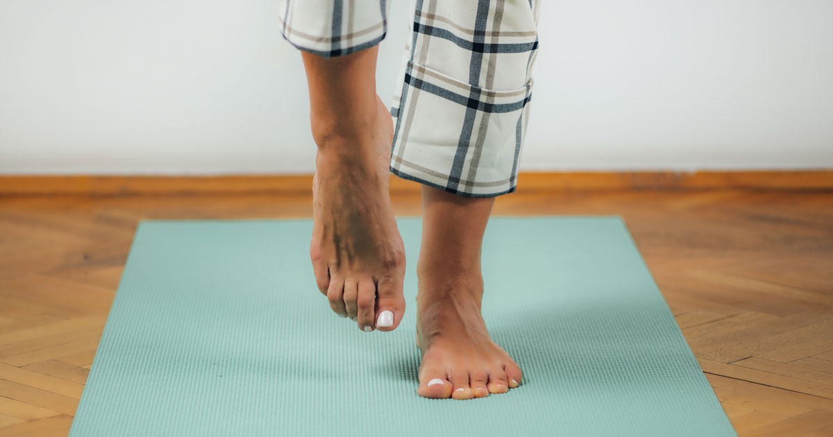 Woman balancing on one foot. Credit / Shutterstock