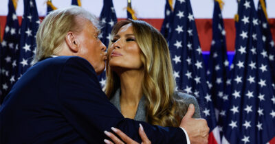 Donald and Melania share an awkward kiss. Credit / Getty Images