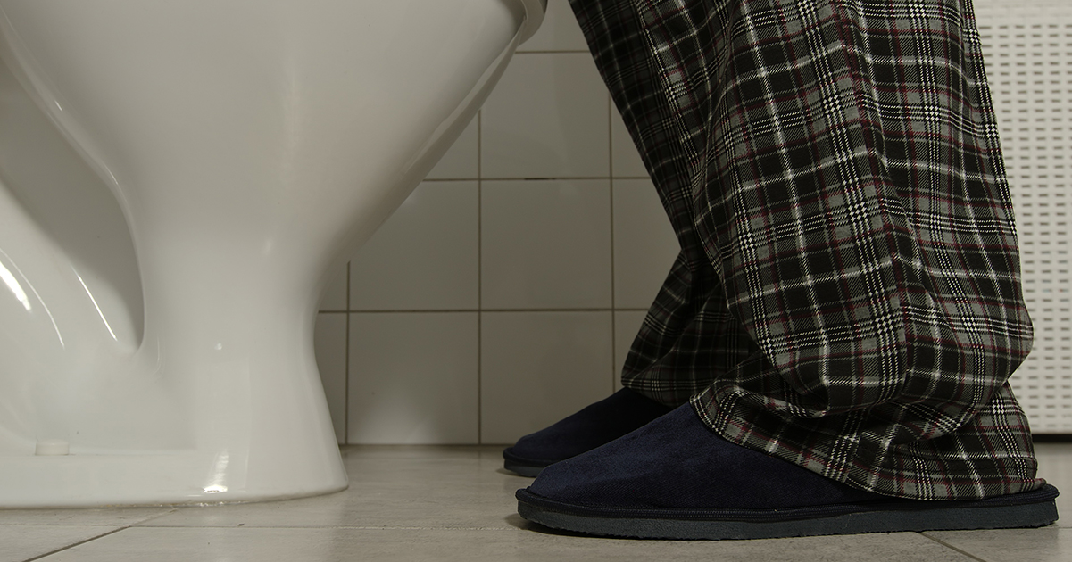 Man goes to the toilet. Credit / Shutterstock
