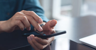 Girl texts on phone. Credit / Shutterstock