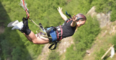 Woman bungee jumping. Credit / Shutterstock