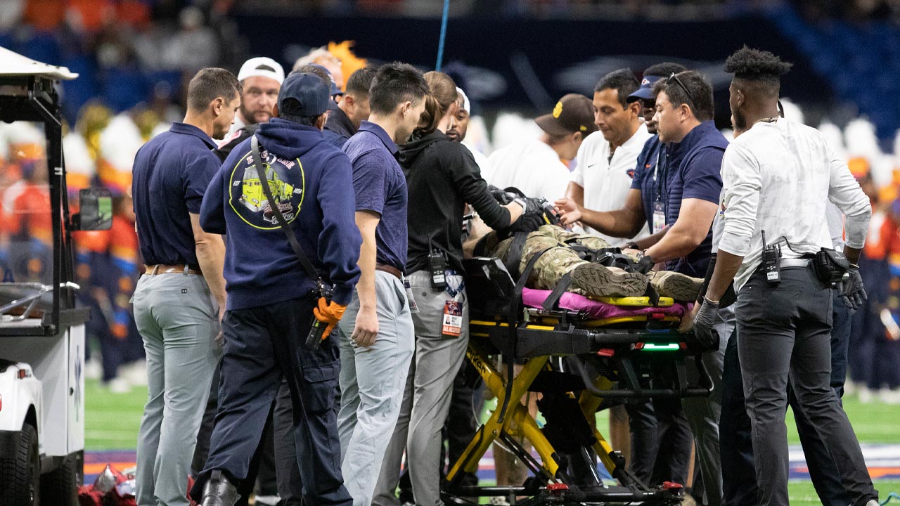 Emergency responders tend to a service member after an accident repelling from the roof before a football game against Navy at the Alamodome, Saturday, October 17, 2026.
