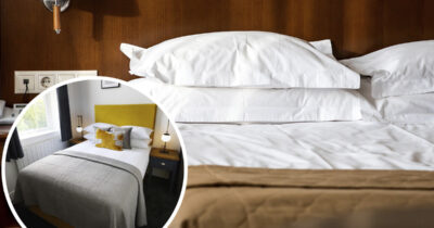 Hotellihuoneen sängyn päällä on ylimääräinen viltti, jonka taustalla on sekä käytännöllisiä että esteettisiä syitä.