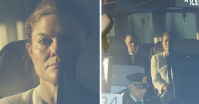 Kronprinsesse Victoria sitter med alvorlig mine i et kjøretøy, omgitt av personale